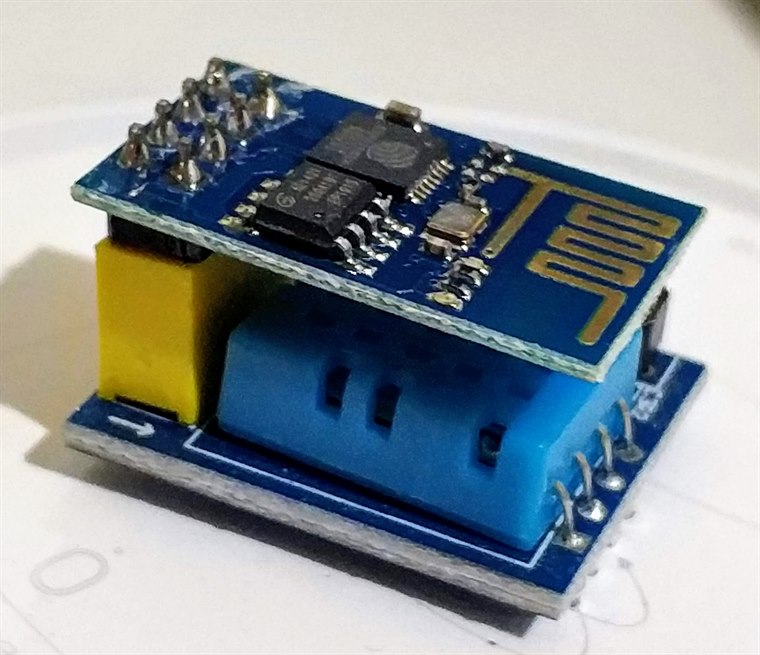 An ESP8266 WiFi module stacked on a DHT11 temperature and humidity sensor