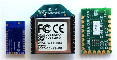 Three different RF radio modules side by side, including an XBee module