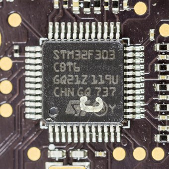 An STM32 microcontroller in an LQFP package soldered to a circuit board