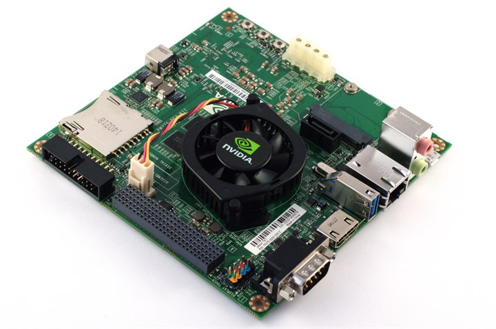 An edge-AI board carrying the accelerator, memory, power conversion and active cooling on one assembly