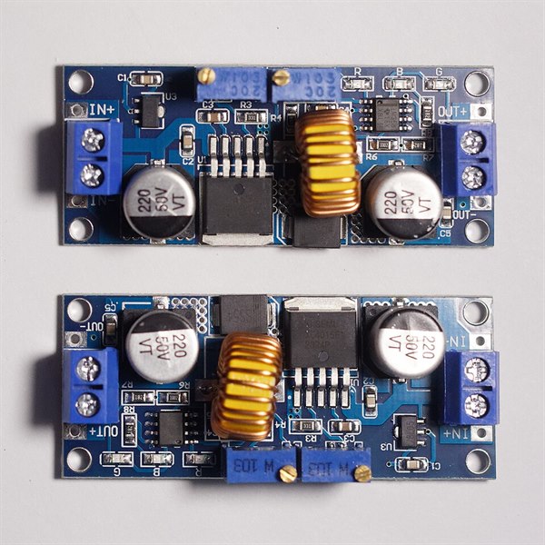 A buck regulator module with its inductor and bulk capacitors beside the switching device
