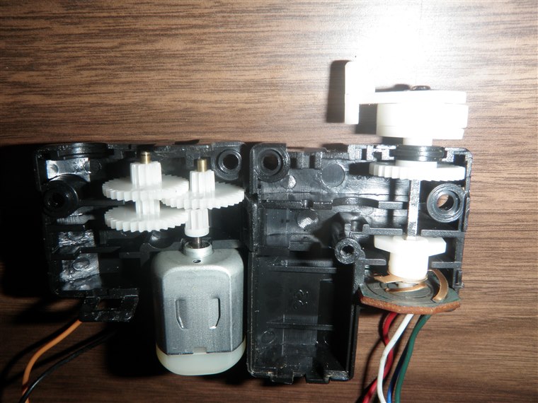 Inside a servo motor showing gears and position feedback